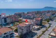 Kupić Umeblowane mieszkanie w dzielnicy Kestel z przeszklonym balkonem i widokiem na góry 1 