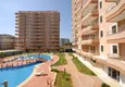 Kupić Apartament w Mahmutlarze z autorskim remontem, przeszklonymi balkonami i widokiem na morze 10 