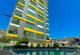 Kupić Umeblowany apartament 3+1 z przeszklonym balkonem i widokiem na góry - Centrum Alanya 1