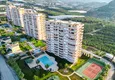Kupić Panoramiczny apartament z dwiema sypialniami i meblami, przeszklony balkon w Mahmutlar 1 