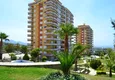 Kupić Panoramiczny apartament z dwiema sypialniami i meblami, przeszklony balkon w Mahmutlar 6 