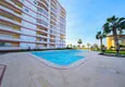 Kupić Panoramiczny apartament z dwiema sypialniami i meblami, przeszklony balkon w Mahmutlar 9 