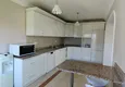 Dostępny zakup Panoramiczny apartament z dwiema sypialniami i meblami, przeszklony balkon w Mahmutlar 10 