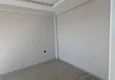 Dostępny zakup Apartament z jedną sypialnią z pięknym wykończeniem i widokiem na góry w dzielnicy Tomyuk, Mersin. Rata jest możliwa 11