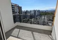Dostępny zakup Apartament z jedną sypialnią z pięknym wykończeniem i widokiem na góry w dzielnicy Tomyuk, Mersin. Rata jest możliwa 14