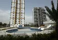 Kupić Apartament z jedną sypialnią z pięknym wykończeniem i widokiem na góry w dzielnicy Tomyuk, Mersin. Rata jest możliwa 4