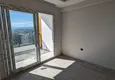 Dostępny zakup Apartament z jedną sypialnią z pięknym wykończeniem i widokiem na góry w dzielnicy Tomyuk, Mersin. Rata jest możliwa 6