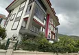 Kupić Apartament w centrum Alanyi z oddzielnymi meblami kuchennymi i widokiem na góry  1 