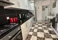 Dostępny zakup Apartament w centrum Alanyi z oddzielnymi meblami kuchennymi i widokiem na góry  4 