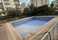 Kupić Apartament z dwiema sypialniami i przeszklonym balkonem w Mersin, dzielnica Tomyuk 2 