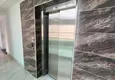 Kupić Apartament 1+1 w Mahmutlar, pod klucz z przeszklonym balkonem w nowoczesnym kompleksie 19 