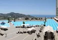 Kupić Umeblowane mieszkanie 2+1 do wynajęcia w Alanyi, dzielnica Mahmutlar — legendarny kompleks hotelowy z prywatną plażą nr 708 9