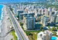 Kupić Apartament 1+1 przy plaży w Mahmutlar — umeblowany i z panoramicznym widokiem na morze 1
