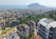 Kupić Duplex ogrodowy z widokiem na morze i fortecę w centrum Alanyi — odpowiedni dla obywatelstwa i pozwolenia na pobyt 1