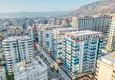 Kupić 1+1 mieszkanie 70 m² w centrum Mahmutlar — umeblowane, przeszklony balkon, raty do 1 roku 2