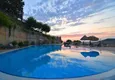 Kupić 4+1 willa na terenie kompleksu hotelowego w Mahmutlar — meble, ogród, widok panoramiczny 10