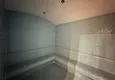 Kupić Wykończony apartament z dwiema sypialniami w kompleksie w budowie w Mahmutlar 14