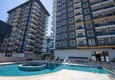 Kupić Wykończony apartament z dwiema sypialniami w kompleksie w budowie w Mahmutlar 3
