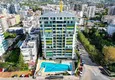 Kupić Apartament 2+1 w Mahmutlar — meble, widok na góry, pierwsza linia brzegowa 1