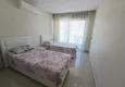 Dostępny zakup Apartament 2+1 w Mahmutlar — meble, widok na góry, pierwsza linia brzegowa 11