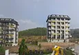 Kupić Nieruchomość w Alanyi z ratami do 1 roku - nowy apartament 1+1 z widokiem na morze w Avsallar 10 