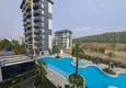 Kupić Nieruchomość w Alanyi z ratami do 1 roku - nowy apartament 1+1 z widokiem na morze w Avsallar 9 