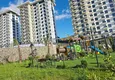 Kupić Nieruchomość w Alanyi z widokiem na morze - apartament 1+1 w Mahmutlar 13 