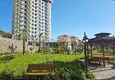 Kupić Nieruchomość w Alanyi z widokiem na morze - apartament 1+1 w Mahmutlar 14 