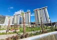 Kupić Nieruchomość w Alanyi z widokiem na morze - apartament 1+1 w Mahmutlar 16 