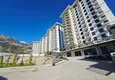 Kupić Nieruchomość w Alanyi z widokiem na morze - apartament 1+1 w Mahmutlar 18 