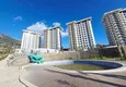Kupić Nieruchomość w Alanyi z widokiem na morze - apartament 1+1 w Mahmutlar 2 