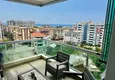 Kupić Apartament 1+1 w Tosmur, 76 m2 z meblami i widokiem na morze - nieruchomość na zezwolenie na pobyt w Alanyi  1 