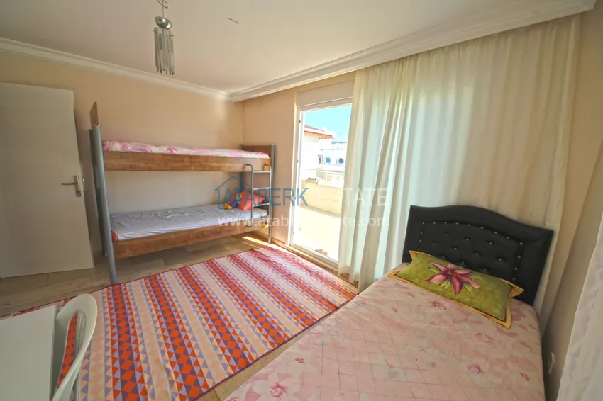 Kupuj Dwupoziomowy penthouse w Mahmutlarze z umeblowaną oddzielną kuchnią i widokiem na morze 11 