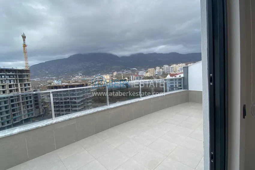 Kupuj Umeblowany dwupoziomowy penthouse w Mahmutlar z widokiem na góry, morze i historyczną fortecę 14