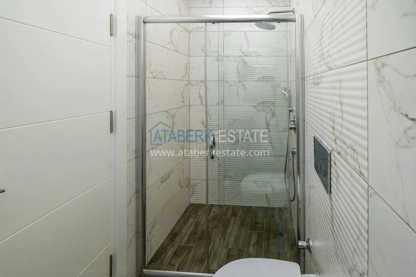 Kupuj  Dwupoziomowy penthouse 2+1 z meblami w obszarze otwartym na zezwolenia na pobyt, centrum Alanya 11 