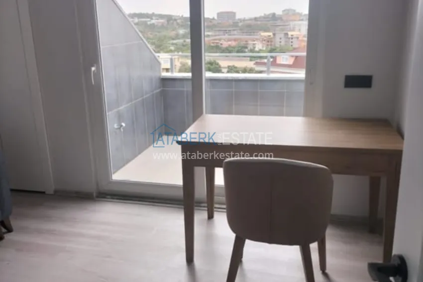 Kupuj  Dwupoziomowy penthouse 2+1 częściowo umeblowany z widokiem na morze, dzielnica Oba - Alanya. Nadaje się do zezwolenia na pobyt! 12 