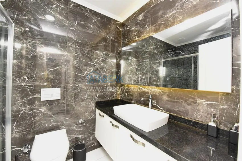 Kupuj  Kompaktowy penthouse 1+1 do wynajęcia w Kargicak z bezpośrednim widokiem na morze i góry C12 11 