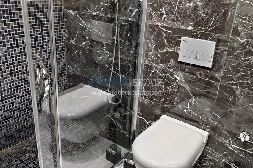 Kupuj  Kompaktowy penthouse 1+1 do wynajęcia w Kargicak z bezpośrednim widokiem na morze i góry C12 13 