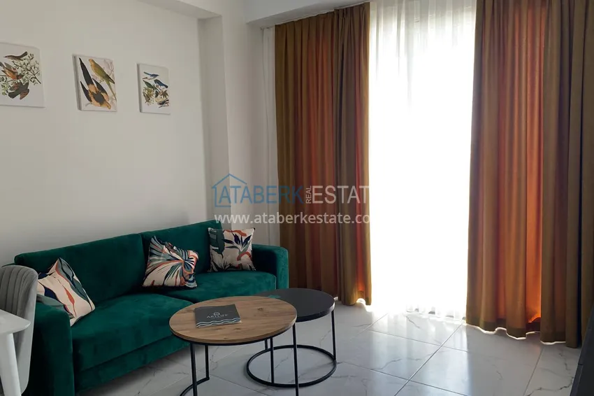 Kupuj  Wynajmij apartament 1+1 z meblami i tarasem w nowym nowoczesnym kompleksie — Alanya, dzielnica Avsallar  1 
