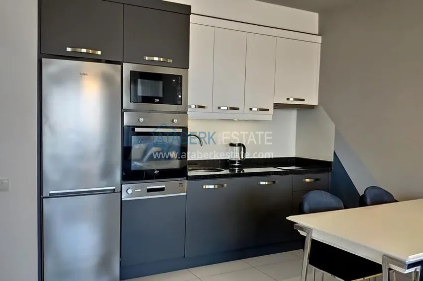Kupuj  Kompaktowy penthouse 1+1 do wynajęcia w Kargicak z bezpośrednim widokiem na morze i góry C12 7 