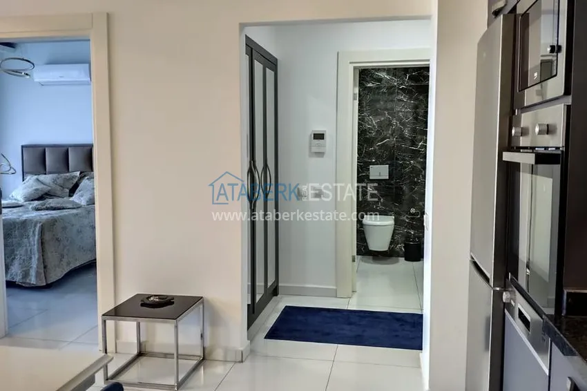 Kupuj  Kompaktowy penthouse 1+1 do wynajęcia w Kargicak z bezpośrednim widokiem na morze i góry C12 8 