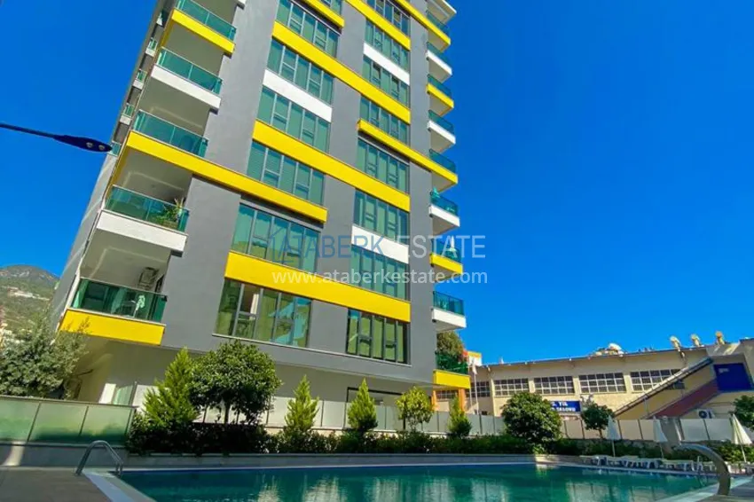 Umeblowany apartament 3+1 z przeszklonym balkonem i widokiem na góry - Centrum Alanya 1 