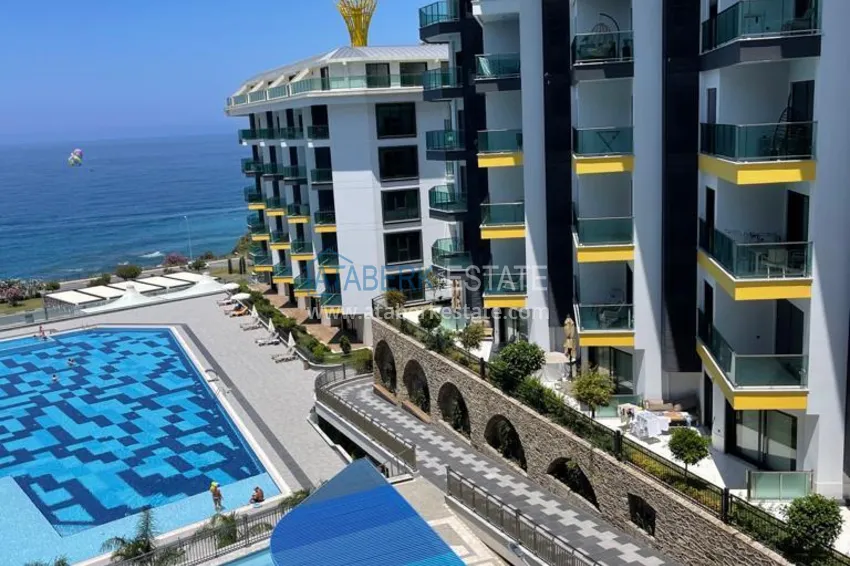 Kupuj  Umeblowane mieszkanie 1+1 w kompleksie nad brzegiem morza — Alanya, dzielnica Kargicak 10 