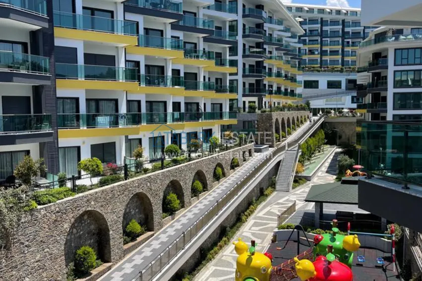 Kupuj  Umeblowane mieszkanie 1+1 w kompleksie nad brzegiem morza — Alanya, dzielnica Kargicak 14 