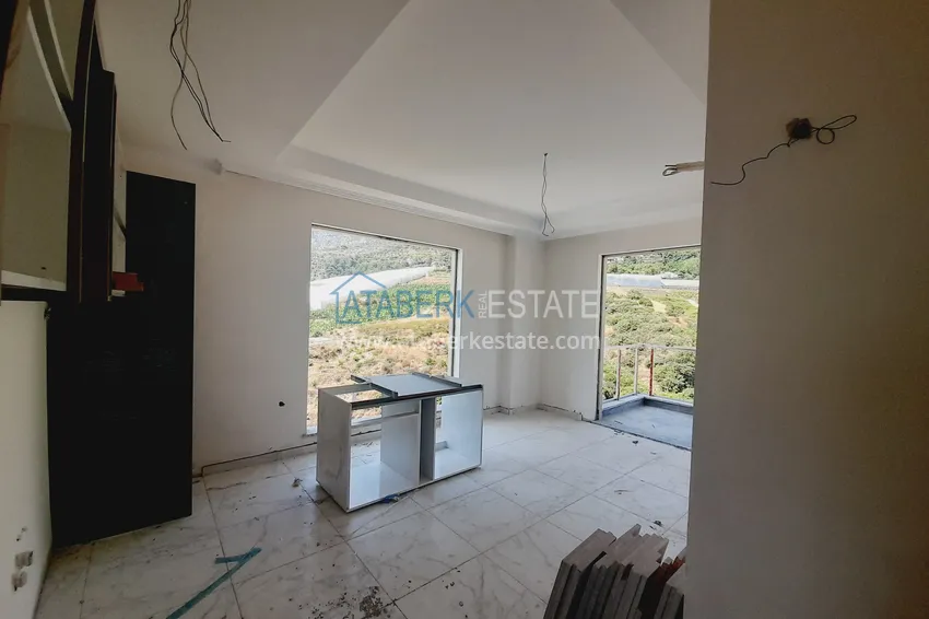 Kupuj  Oferta inwestorska: Apartament z jedną sypialnią i widokiem na góry w kompleksie premium — Alanya, Mahmutlar 1 