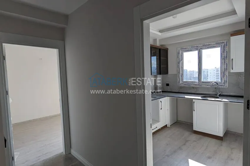 Kupuj  Apartament z jedną sypialnią z pięknym wykończeniem i widokiem na góry w dzielnicy Tomyuk, Mersin. Rata jest możliwa 3 