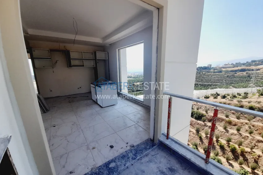 Kupuj  Oferta inwestorska: Apartament z jedną sypialnią i widokiem na góry w kompleksie premium — Alanya, Mahmutlar 4 