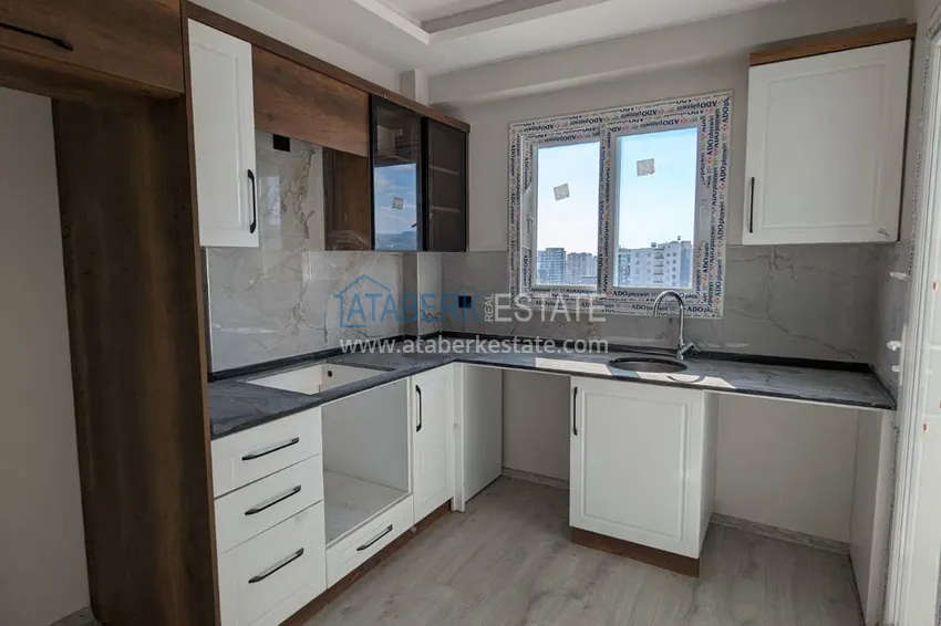 Kupuj  Apartament z jedną sypialnią z pięknym wykończeniem i widokiem na góry w dzielnicy Tomyuk, Mersin. Rata jest możliwa 4 