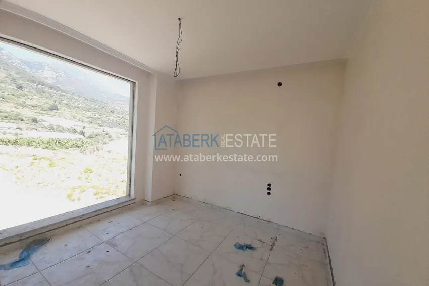 Kupuj  Oferta inwestorska: Apartament z jedną sypialnią i widokiem na góry w kompleksie premium — Alanya, Mahmutlar 5 
