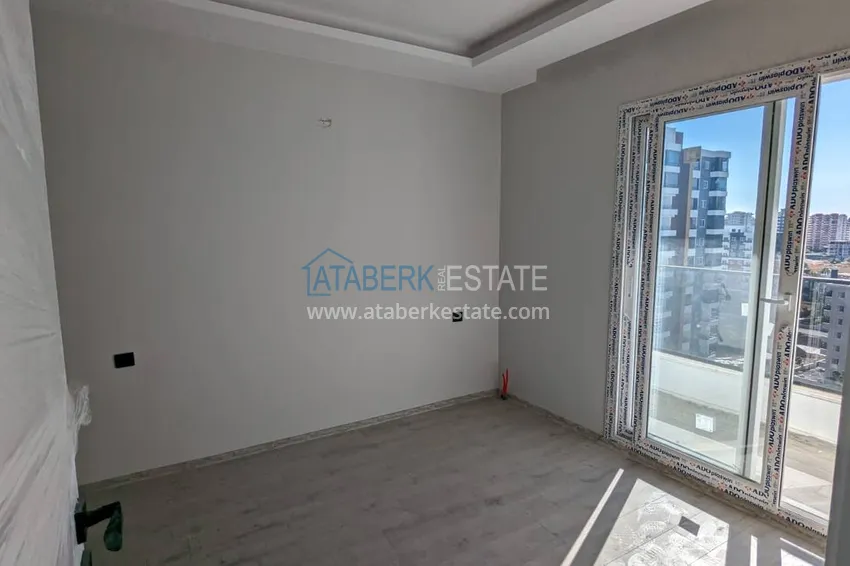 Kupuj  Apartament z jedną sypialnią z pięknym wykończeniem i widokiem na góry w dzielnicy Tomyuk, Mersin. Rata jest możliwa 7 